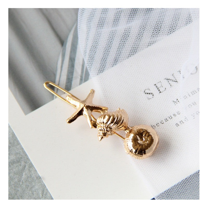 Hårspænde guld musling eCarla